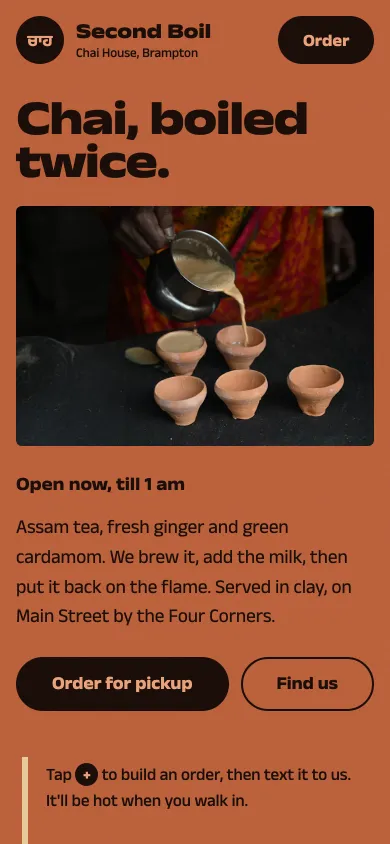 Second Boil Chai House on a phone